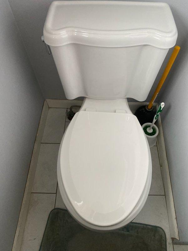 Responded to service call for continuously running toilet. Upon inspection, identified extensive calcium buildup and mineral deposits throughout the internal tank components, affecting the fill valve and flapper mechanism. The existing toilet was an older generic model showing significant age-related deterioration, with visible staining and corrosion inside the tank. 

Determined that repair was not cost-effective given the condition of the fixture. Performed complete toilet replacement, installing a new ADA-compliant toilet to meet current accessibility standards and ensure reliable long-term performance. Removed old toilet, prepared flange and mounting area, set new fixture with proper wax ring seal, secured mounting bolts, and connected water supply line. Tested flush operation and verified proper fill cycle, water level, and seal integrity with no leaks detected.