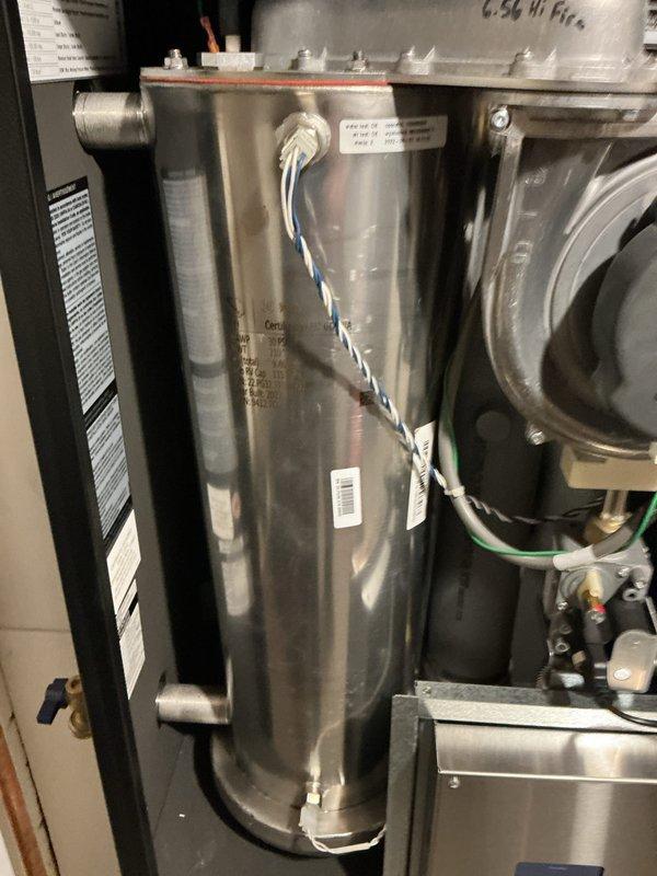 Completed scheduled maintenance on 25-year-old Trane air conditioning system and 3-year-old boiler system with hydronic heating distribution. Inspected multi-zone heating system including Extrol expansion tank, circulator pump, zone valves, brass manifolds, and PEX distribution lines; all components operating within normal parameters. Performed AC tune-up and boiler maintenance per agreement terms; verified proper operation of all equipment with no issues found.