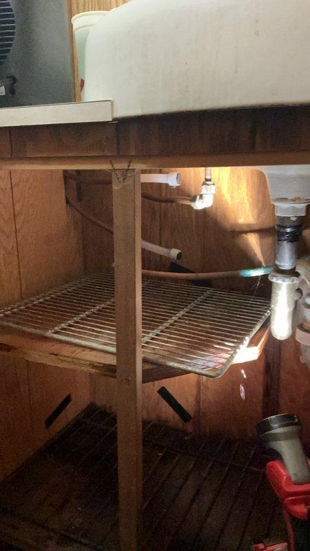Responded to service call for malfunctioning water softener system experiencing overworking cycles and flooding issues. Upon inspection, determined unit required replacement due to operational failure. Capped off sink water supply lines to address dripping faucet concerns and prevent further water waste.