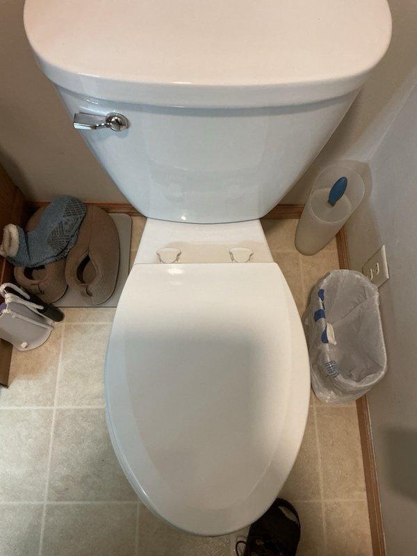 Responded to complaint of toilet seat repeatedly coming loose and failing to remain securely fastened. Upon inspection, determined that the existing easy-clean lock mechanism was unlocking spontaneously due to normal use and movement. Verified that mounting hardware was properly tightened to manufacturer specifications. Identified defective quick-release locking mechanism as root cause of instability. Removed existing toilet seat assembly and installed new replacement seat with functional locking hardware to ensure secure, stable seating surface.
