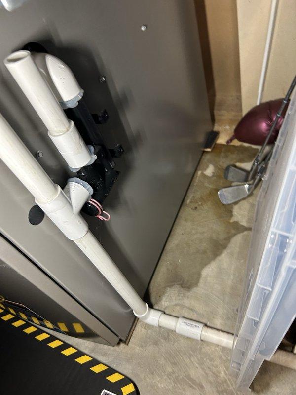 Responded to service call for 8-12 furnace leaking water onto floor from condensate drain system. Upon inspection, found improperly wrapped insulation causing condensation buildup and plugged condensate trap on two-year-old unit. Cleared condensate trap, properly insulated furnace corners and edges with tape, and advised that air filter requires replacement.