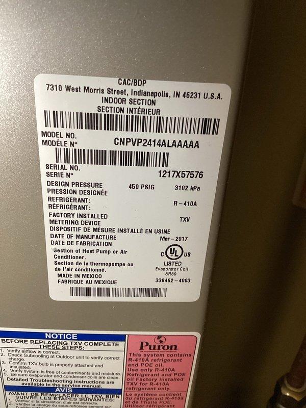 Completed scheduled furnace tune-up and maintenance on a 9-year-old Bryant system (Model CNPVP2414ALAAAAA, manufactured March 2017) utilizing R-410A refrigerant. All components inspected and verified operational, with thermostat displaying proper room temperature of 73°F and system functioning within normal parameters.