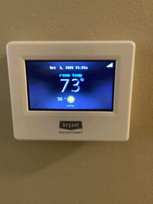 Completed scheduled furnace tune-up and maintenance on a 9-year-old Bryant system (Model CNPVP2414ALAAAAA, manufactured March 2017) utilizing R-410A refrigerant. All components inspected and verified operational, with thermostat displaying proper room temperature of 73°F and system functioning within normal parameters.