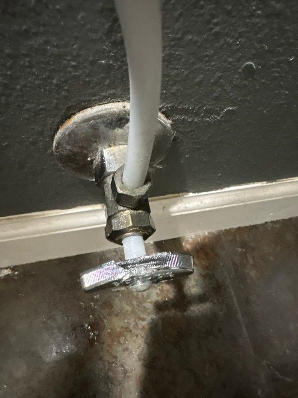 Responded to a non-functional toilet water shut-off valve that prevented the customer from performing necessary toilet repairs. Upon inspection, identified a broken water supply line valve at the wall connection to the toilet. Removed the failed compression fitting valve and installed a new replacement valve, ensuring proper threading and secure connection to both the supply line and toilet fill valve. Tested the new shut-off valve for proper operation and verified no leaks at the connection points.