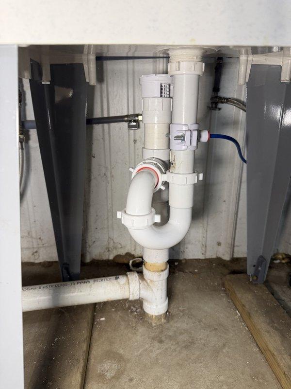 Responded to callback for recurring drainage issues at dog wash station. Found water leaking at connections beneath tub with evidence of floor saturation. Identified loose basket strainer as source of leak. Removed and properly reinstalled basket strainer using silicone sealant to ensure watertight seal. Performed drainage test to verify proper operation and confirmed all connections secure with no further leakage detected.