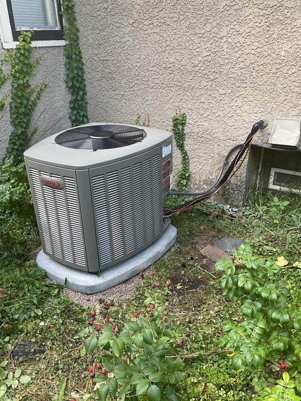 Completed full HVAC system upgrade by removing existing 80% efficiency furnace and installing new EL297V 97% AFUE two-stage variable speed upflow furnace rated at 70,000 BTU. Added complete air conditioning system including EL15KC1 15.9 SEER2 single-stage 2.5 ton outdoor condenser unit and 3-ton B-frame cased evaporator coil with factory-installed TXV valve. Upgraded to high-efficiency 90% furnace requiring new PVC venting installation to meet condensing furnace requirements. Coordinated with electrician for installation of new dedicated electrical circuit to support upgraded equipment. Installed new outdoor concrete pad, disconnect box, and electrical whip for condenser unit. Mounted outdoor unit on pad against building exterior with proper refrigerant line connections using insulated line set. Performed system commissioning including pressure testing with dual-port manometer to verify proper refrigerant charge and airflow. All equipment installed per manufacturer specifications and l
