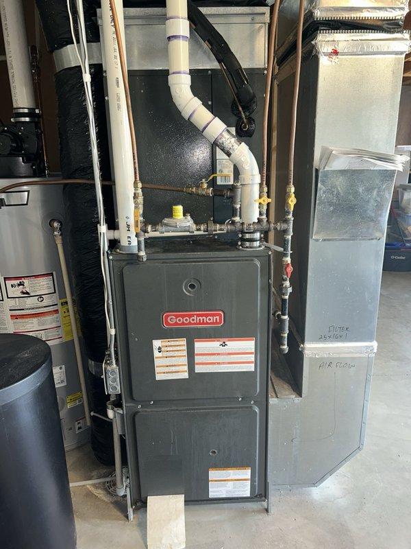 Responded to no heat call on aging Goodman furnace that was producing unusual noises and odors upon startup. Found heating sequence operating normally but blower motor failing to start despite loud humming. Diagnostic testing revealed capacitor reading 17.0/20 MFD and proper 122.0V supply from control board to motor. Blower wheel turned freely by hand, confirming internal motor failure rather than mechanical obstruction or electrical supply issue. Replaced failed blower motor and verified proper system operation upon completion.