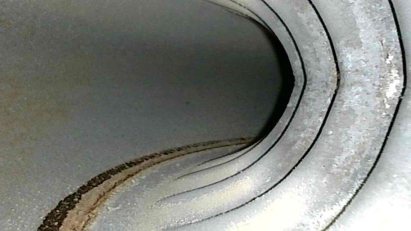 Completed comprehensive maintenance tune-up on 17-year-old furnace including cleaning flame sensor, verifying condensate drain clearance, and inspecting heat exchanger. All electrical components tested within specification, gas pressure adjusted to proper levels, and temperature rise verified at operating temperature with system functioning correctly.