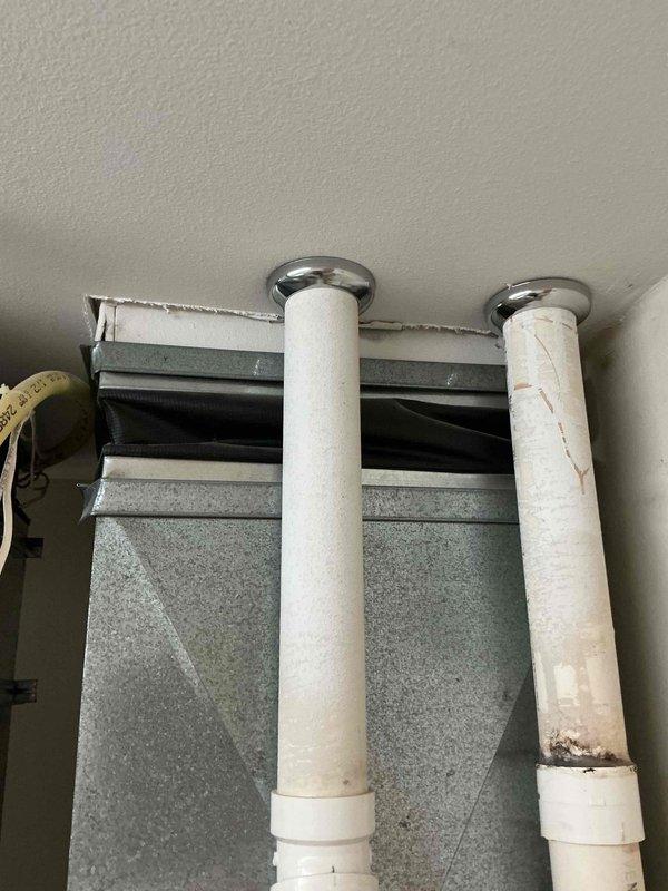 Responded to service call at recently purchased condominium for furnace evaluation and potential ductwork issue. Homeowner reported concern about ductwork appearing to hang down from ceiling, creating operational problems. Upon inspection, identified that the perceived issue was actually the black flexible spacer connector between the furnace and main ductwork, which is a standard component designed to allow height adjustment and accommodate thermal expansion. Explained to homeowner that this component is normal and functioning as designed.

Performed comprehensive furnace inspection and maintenance service. Conducted thorough examination of heat exchanger for cracks or deterioration. Cleaned flame sensor to ensure proper ignition and burner operation. Inspected all furnace components including blower assembly, gas valve, ignition system, and safety controls. Verified all systems operational and functioning within normal parameters. Unit tested successfully with heat cycle completing p