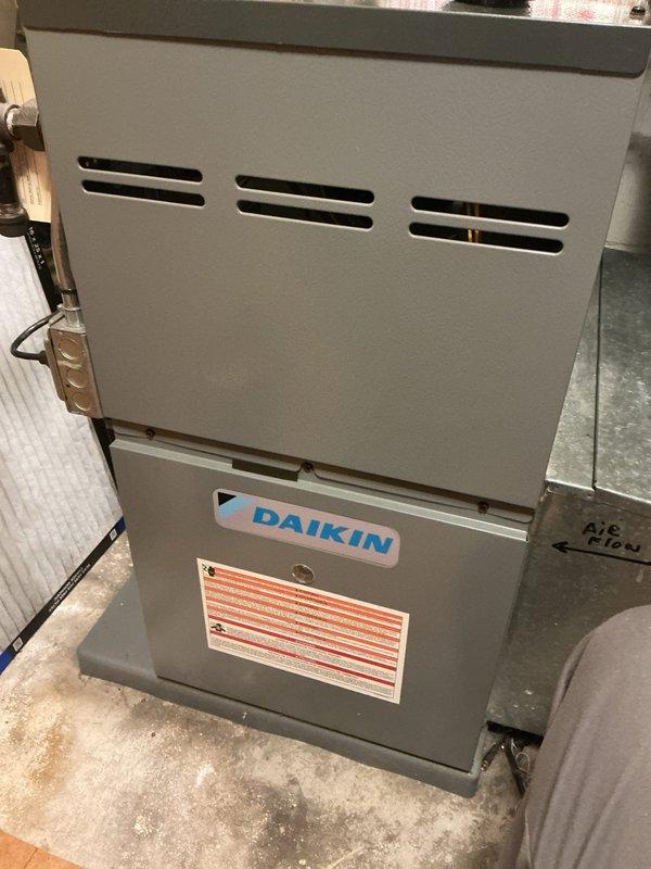 Completed annual heating maintenance visit on an 8-year-old Daikin furnace. Performed comprehensive tune-up including testing all electrical components, verifying gas pressure within specifications, and measuring carbon monoxide levels in the flue to confirm safe operation. Inspected blower motor assembly, gas valve, and all electrical connections. Confirmed filter and system cleanliness, and verified all components are functioning properly within manufacturer specifications. Unit is fully operational with no issues identified.