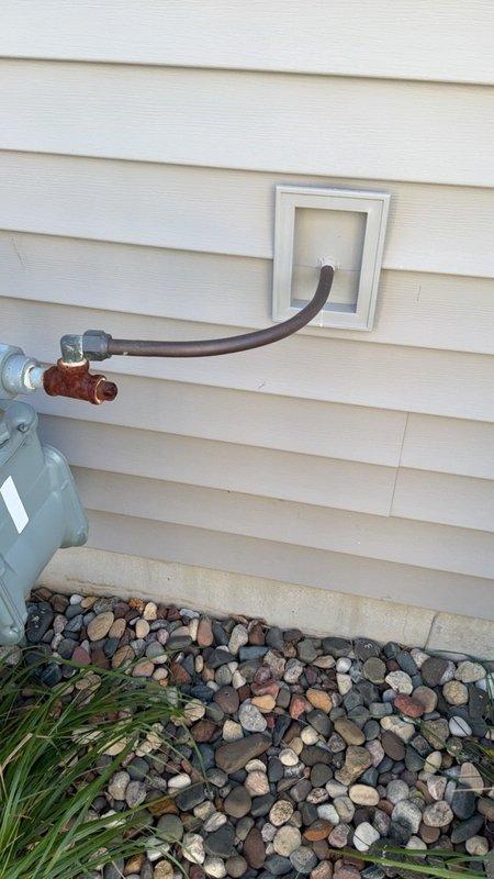 Conducted on-site assessment for water heater replacement at residential property. Evaluated existing tank-style water heater nearing end of service life and inspected current gas supply infrastructure, including gas meter, copper gas line routing, and exterior venting system to determine feasibility of tankless on-demand water heater installation versus conventional tank replacement. Documented existing utility connections, gas line sizing, venting configuration through exterior wall, and available space for equipment upgrade. Provided homeowner with options for both tankless and traditional tank water heater systems, discussing requirements for gas line modifications, venting changes, and electrical upgrades that would be necessary for tankless conversion. Additionally discussed scheduling furnace tune-up and maintenance service prior to heating season as requested.