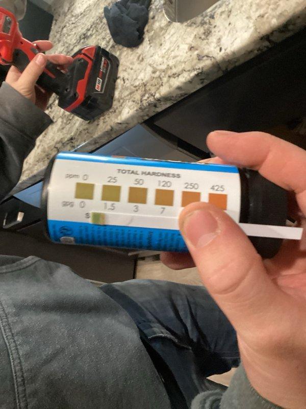 Completed comprehensive plumbing inspection of residential property, including evaluation of Bradford White water heater installation and water quality testing using total hardness test strips in crawl space or attic area. Documented findings with photos and provided detailed estimates for recommended repairs or improvements identified during inspection.