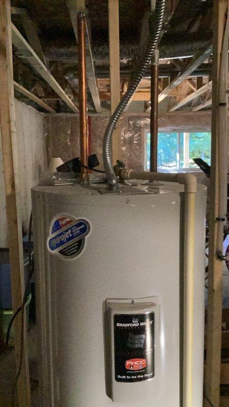Completed comprehensive plumbing inspection of residential property, including evaluation of Bradford White water heater installation and water quality testing using total hardness test strips in crawl space or attic area. Documented findings with photos and provided detailed estimates for recommended repairs or improvements identified during inspection.
