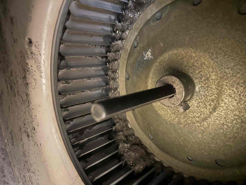 Completed comprehensive furnace tune-up on 20-year-old heating system in preparation for winter season. During inspection, identified blower capacitor reading out of specification and replaced with new capacitor rated at 10μF, 370VAC. Unable to perform complete heat exchanger inspection due to silicone sealant on limit switch area. Reset furnace controls and verified proper system operation. Observed significant dust and debris accumulation on blower wheel and housing. All accessible components inspected and system confirmed operational following capacitor replacement.