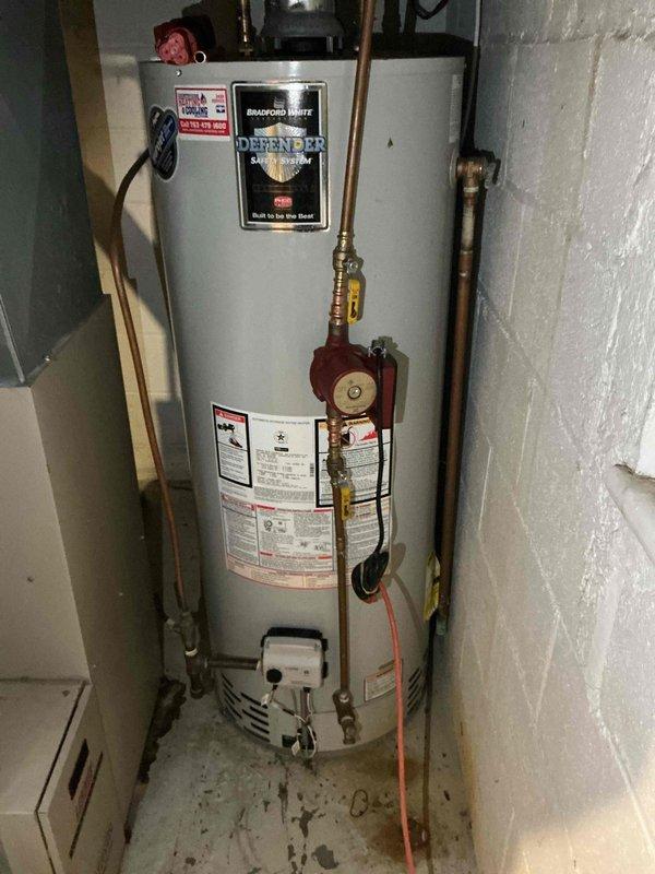 Supplied and installed a new hot water recirculation pump on a Bradford White residential water heater system. The red circulation pump was mounted to the front of the unit with proper piping connections to enable continuous hot water circulation throughout the home. Upon completion, the system was tested to verify proper pump operation and flow, all connections were inspected for leaks, and the work area was cleaned of debris. A one-year parts and labor warranty is included with this installation.