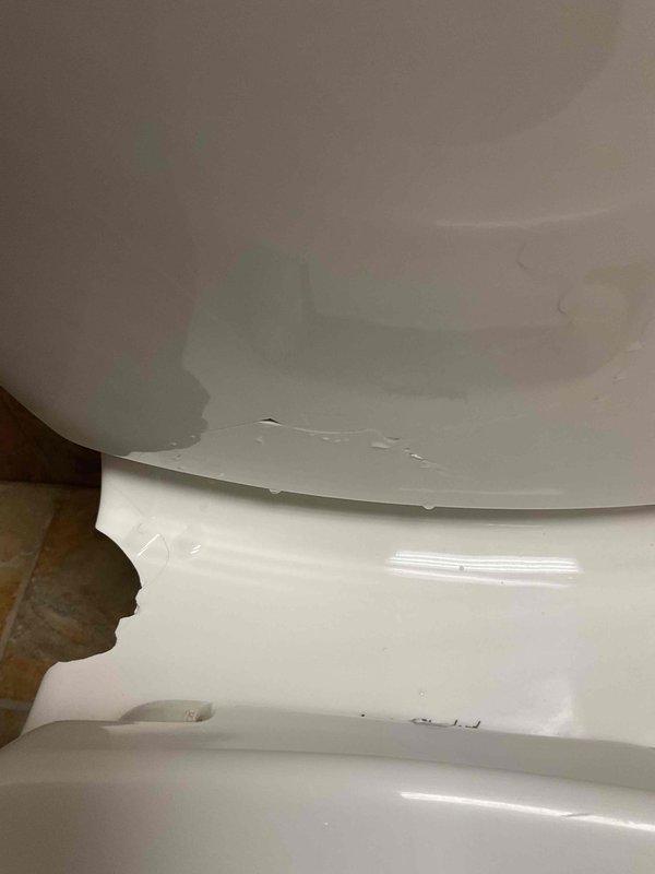 Responded to unisex bathroom facility for toilet replacement due to structural damage where the fixture was broken off from the rear wall mounting. Upon arrival, water supply was already shut off to the unit. Removed damaged toilet, inspected wall mounting area and flange connection, and installed new quiet-flush toilet system with proper wall anchoring and sealed connections. Tested unit for proper operation and verified no leaks at supply line or base seal.