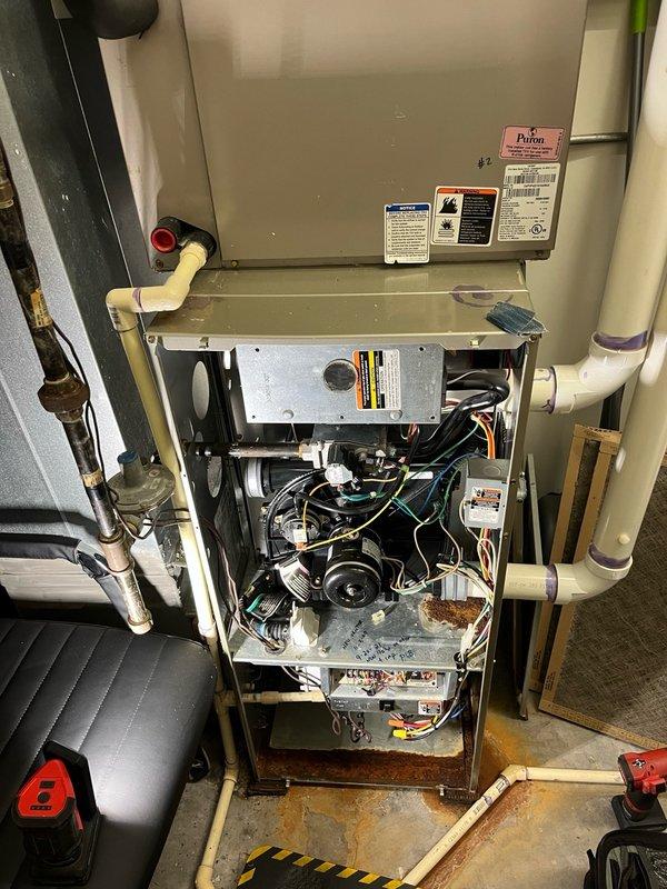 Performed fall maintenance tune-ups on three rooftop furnace units. Unit #1 tested in good working condition with proper heat operation. Unit #2 found with compromised secondary heat exchanger showing active leaking and was tagged out of service for safety. Unit #3 exhibited rough operating condition with water leaking in secondary heat exchanger areas and evidence of water dripping from evaporator coil, though no compromises detected in heat exchanger. Documented findings with photos of affected components including evaporator coil water damage and internal furnace assembly. Contacted property management with findings and recommended repair options, with follow-up scheduled for next day consultation.