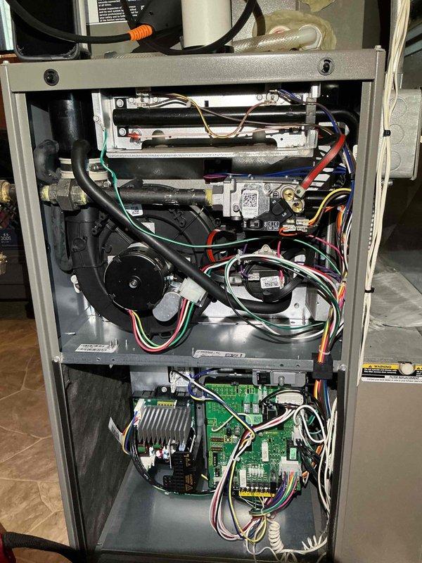Completed annual furnace tune-up on a 2-year-old Lennox unit. Cleaned flame rod and inspected heat exchanger, which showed no rust or corrosion. Verified hot surface igniter ohms within manufacturer specifications and confirmed inducer motor amperage within acceptable range. System tested and confirmed functional with proper heating operation.