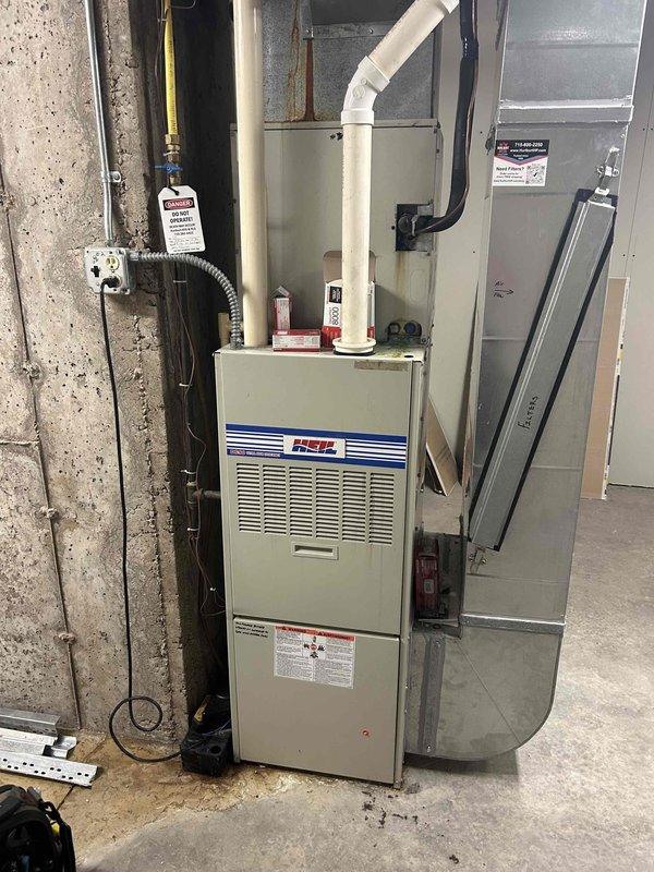 Performed fall maintenance on rooftop units and responded to reported rattling noise complaint. Upon inspection of furnace system, identified failing blower motor causing excessive vibration transmitted through floor and structure. Further diagnostic revealed compromised heat exchanger with visible eyelets present, creating unsafe operating condition. Unit was immediately tagged out of service per safety protocols. Documented findings with photographic evidence showing Heil furnace installation and internal components including capacitor. Provided customer with options for repair including heat exchanger and blower motor replacement versus complete equipment replacement, as property is not customer-owned requiring landlord approval for major expenditure decisions.