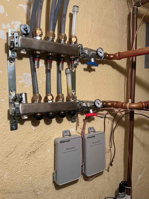 Completed comprehensive preseason heating maintenance on 14-year-old Burnham boiler system with hydronic radiant floor heating distribution, Mitsubishi mini split heat pumps, and two gas fireplaces. Performed full system inspection and operational testing of boiler, radiant manifold assembly with zone controls, flow meters, and all associated components. All systems found operational with no deficiencies noted; equipment ready for heating season.