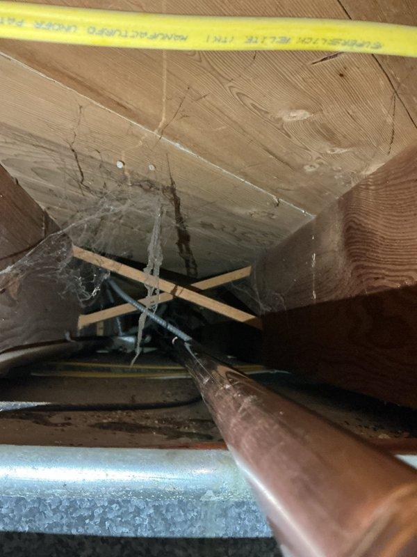 Responded to a water leak emergency involving a pinhole leak in a 1-inch diameter copper main line located just past the shut off valve. The copper piping, dating from the 1950s, had developed a small perforation requiring immediate repair to prevent water damage. Successfully repaired the compromised section of the main line, restoring full water pressure and eliminating the leak.