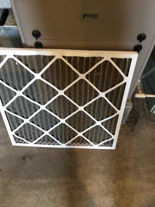 Responded to no cooling complaint on air conditioning system. Upon inspection, found evaporator coil completely iced over due to severely restricted airflow. Identified return air filter as completely plugged with dust and debris, preventing proper air circulation across the coil. Instructed occupant to replace the dirty filter immediately and run system in fan-only mode for several hours to allow ice buildup to thaw completely before resuming cooling operation. Advised to monitor system performance and contact for follow-up if cooling issues persist after thaw cycle completes.