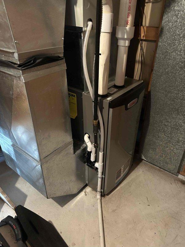 Completed comprehensive furnace maintenance tune-up on two Lennox furnace systems at residential property. Performed full inspection and testing protocol on both units, including blower assembly examination, airflow verification, heat exchanger inspection, and operational safety checks. The older unit, approximately five years in service, showed clean blower wheel with properly spaced blades and no debris accumulation. Verified all electrical connections, tested ignition sequence, and confirmed proper venting and condensate drainage through PVC piping systems. Both furnaces tested within manufacturer specifications with no functional deficiencies identified. All components operating efficiently with adequate service clearances maintained.