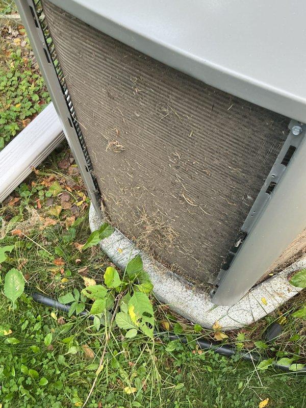 Completed comprehensive tune-up on 7-year-old air conditioning unit and 11-year-old furnace system under maintenance agreement. Addressed heavily soiled condenser coil with significant debris accumulation including leaves, grass clippings, and organic matter; performed thorough coil cleaning to restore heat transfer efficiency. Replaced dirty air filter and performed duct cleaning to address buildup throughout ductwork system, improving airflow and indoor air quality.
