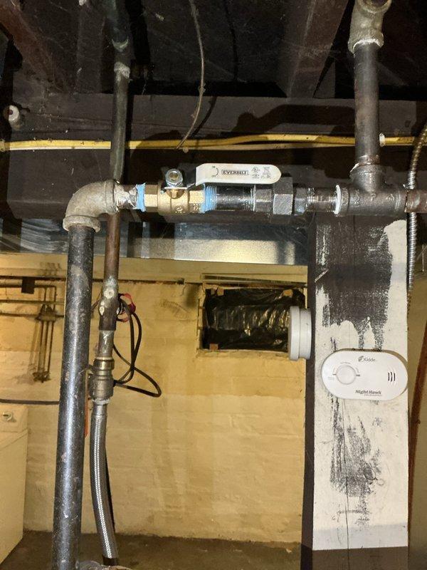 Completed inspection and repairs on tanked water heater system per purchase agreement requirements. Installed new shut-off valve on water supply line with proper threaded fittings to ensure reliable operation. Performed comprehensive gas leak inspection on all gas lines and connections throughout the system, confirming no leaks present. Verified water heater is producing hot water and operating within normal parameters. Inspected all plumbing connections, braided supply lines, and valve assemblies for proper installation and functionality. All corrections completed to bring system into compliance with inspection requirements and proper working order.