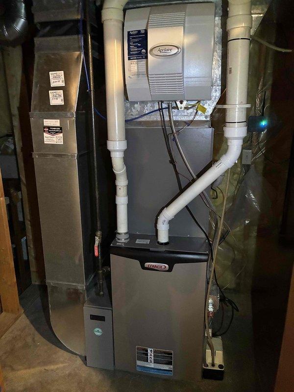 Completed comprehensive furnace preventive maintenance and winter inspection on Lennox gas furnace system with Aprilaire humidifier. Performed standard tune-up procedures including combustion analysis, heat exchanger inspection, burner cleaning, blower assembly service, and filter replacement. Verified proper operation of all safety controls, ignition system, and venting. Inspected and serviced integrated Aprilaire humidifier, checked water supply line, and confirmed proper drainage through PVC condensate system. All components tested and found operating within manufacturer specifications with no deficiencies noted. System ready for heating season.