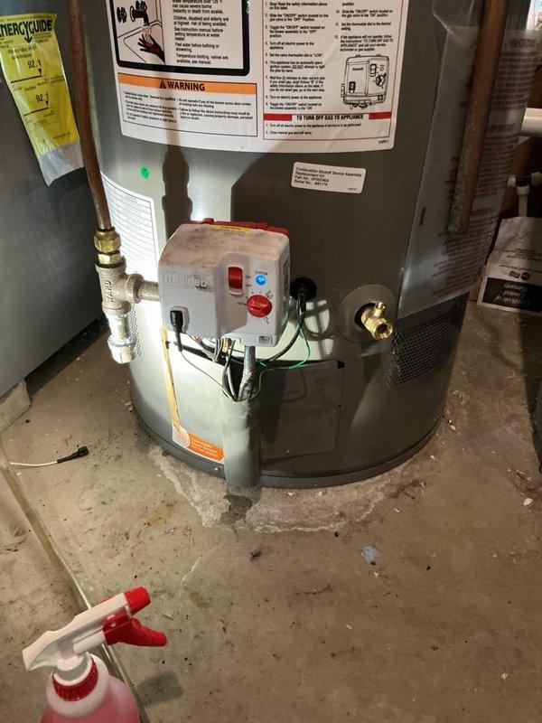 Replaced faulty combustion shutoff device assembly on Rheem residential water heater. Installed new Honeywell control assembly, restored gas supply, and verified proper ignition sequence and flame characteristics. Unit tested and returned to normal operation with all safety controls functioning correctly.