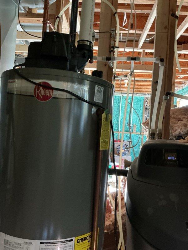 Replaced faulty combustion shutoff device assembly on Rheem residential water heater. Installed new Honeywell control assembly, restored gas supply, and verified proper ignition sequence and flame characteristics. Unit tested and returned to normal operation with all safety controls functioning correctly.