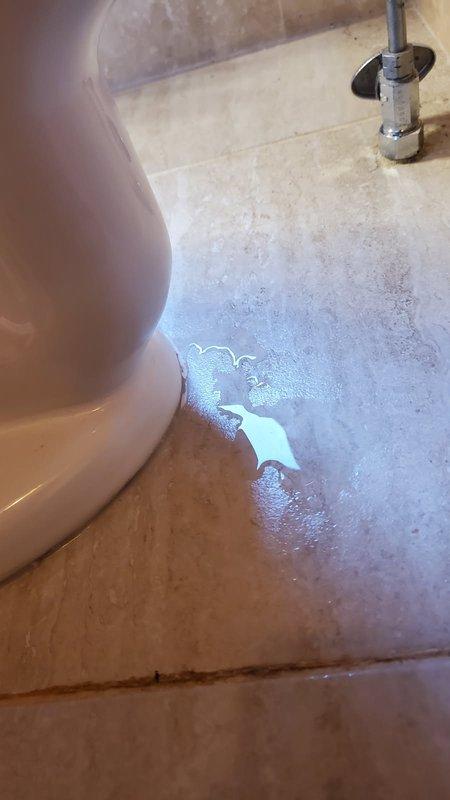 Responded to reported water leak at base of toilet. Upon inspection, identified failed wax ring as source of leak, with visible water pooling on bathroom floor near toilet base. Removed toilet from flange to access and assess seal condition. Confirmed wax ring deterioration with evident discoloration and compromised sealing material around toilet flange. Toilet left uninstalled at homeowner's request pending water damage assessment of subfloor and surrounding area.