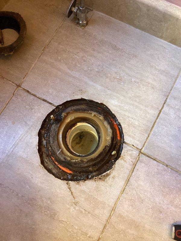 Responded to reported water leak at base of toilet. Upon inspection, identified failed wax ring as source of leak, with visible water pooling on bathroom floor near toilet base. Removed toilet from flange to access and assess seal condition. Confirmed wax ring deterioration with evident discoloration and compromised sealing material around toilet flange. Toilet left uninstalled at homeowner's request pending water damage assessment of subfloor and surrounding area.
