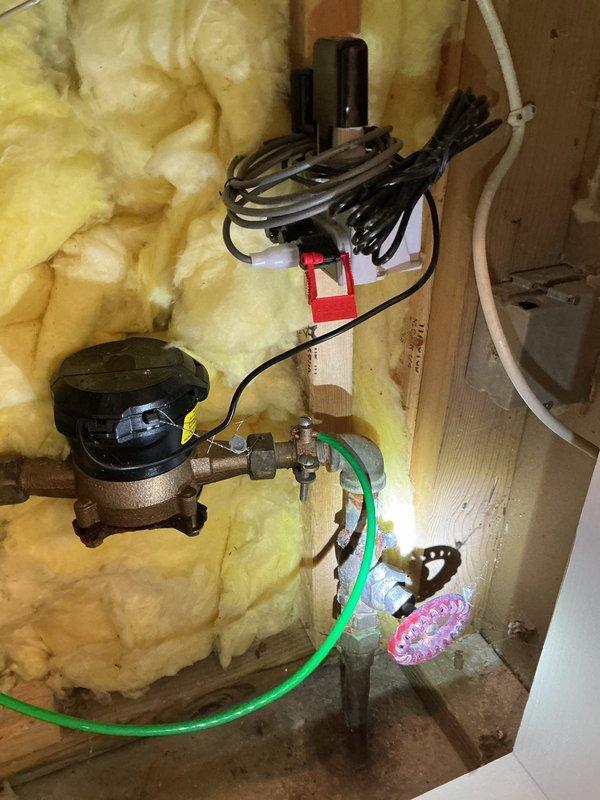 Coordinated city water shut-off at curb to install new 3/4" ball valve and brass fittings on street side of water meter. Removed deteriorated galvanized water supply lines and repiped complete bathroom including new water lines to vanity and toilet with new shut-off valves installed at each fixture. Repiped vanity drain within wall cavity, connecting to existing PVC drain system below. All work completed with proper fittings and connections to restore full water service to bathroom fixtures.