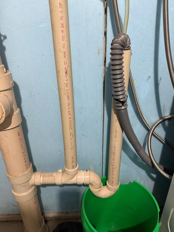 Responded to a washing machine standpipe backup in the basement. Located and cleared a grease plug at the 90-degree bend in the ground using main line cleaning equipment. Performed video camera inspection to verify complete clearance and confirm proper drainage flow.