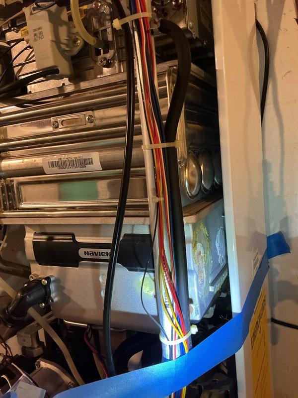 Responded to no hot water call and diagnosed Navien tankless water heater displaying error code 16, indicating overheating condition. Upon inspection, determined unit is an older model no longer under warranty with new homeowner. Provided estimates for repair options and discussed replacement alternatives. Customer elected to self-install a traditional tank-style water heater as replacement solution.