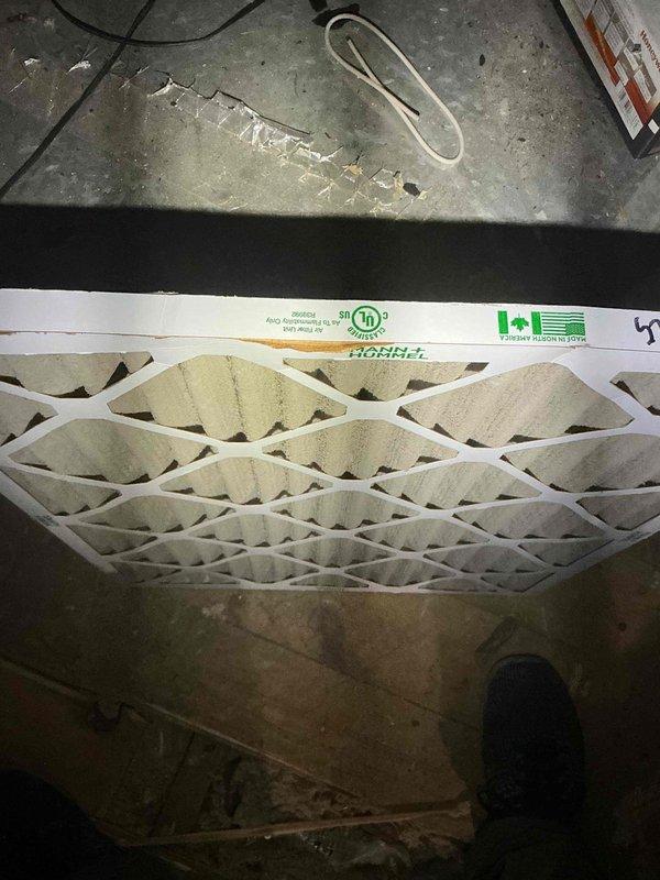 Performed furnace tune-up and inspection on residential property with three HVAC units, focusing on twin attic units displaying error codes and condensation dripping issues. Found severely restricted airflow due to year-old filter not replaced and more than 10 supply vents closed throughout the home. Inspected attic air handler configuration where evaporator coil is positioned remotely from furnace rather than in standard top-mount location. Noted furnace access panels had been previously removed, indicating possible unauthorized service attempts. Identified improper system operation caused by inadequate air circulation from closed vents and clogged filter media. Instructed property owners to open all closed supply vents immediately and install new air filter to restore proper airflow and system function, then monitor for improvement before determining if additional repairs are necessary.
