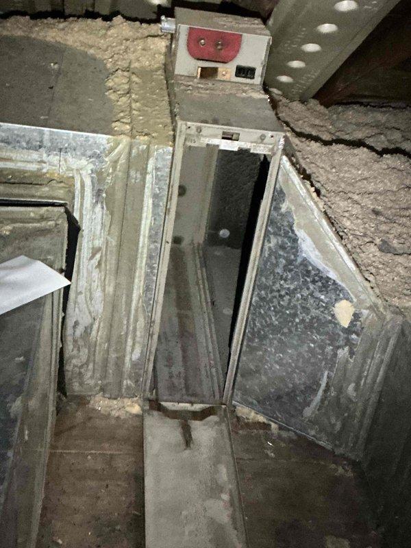 Performed furnace tune-up and inspection on residential property with three HVAC units, focusing on twin attic units displaying error codes and condensation dripping issues. Found severely restricted airflow due to year-old filter not replaced and more than 10 supply vents closed throughout the home. Inspected attic air handler configuration where evaporator coil is positioned remotely from furnace rather than in standard top-mount location. Noted furnace access panels had been previously removed, indicating possible unauthorized service attempts. Identified improper system operation caused by inadequate air circulation from closed vents and clogged filter media. Instructed property owners to open all closed supply vents immediately and install new air filter to restore proper airflow and system function, then monitor for improvement before determining if additional repairs are necessary.