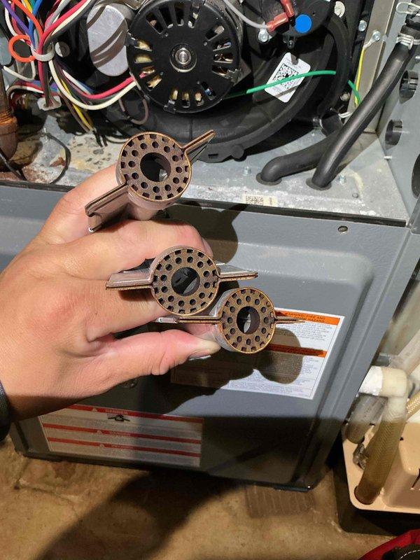 Responded to no heat call on Amana furnace. Upon arrival, unit was heating intermittently but flames would extinguish during operation. Performed initial maintenance including cleaning burners and flame rod. During diagnostic testing, identified pressure switch malfunction caused by condensate drainage blockage. Cleared obstruction in drain line leading to condensate pump, restoring proper water flow. Thoroughly cleaned all condensate drain lines including trap assembly connected to inducer motor, pressure switch tubing, and pump inlet. Cycled unit multiple times to verify consistent ignition and flame stability. System restored to normal heating operation with pressure switch functioning correctly after drainage system was cleared.