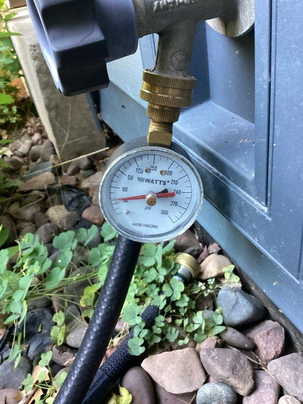 Completed comprehensive plumbing inspection including water heater system pressure testing and toilet tank mechanism evaluation. Water heater is five years old and operating within normal parameters; pressure gauge readings confirmed proper system pressure using calibrated Watts gauge equipment. Interior toilet tank components including flush valve, flapper assembly, and fill valve mechanism inspected and found in satisfactory working condition with no immediate repairs required.