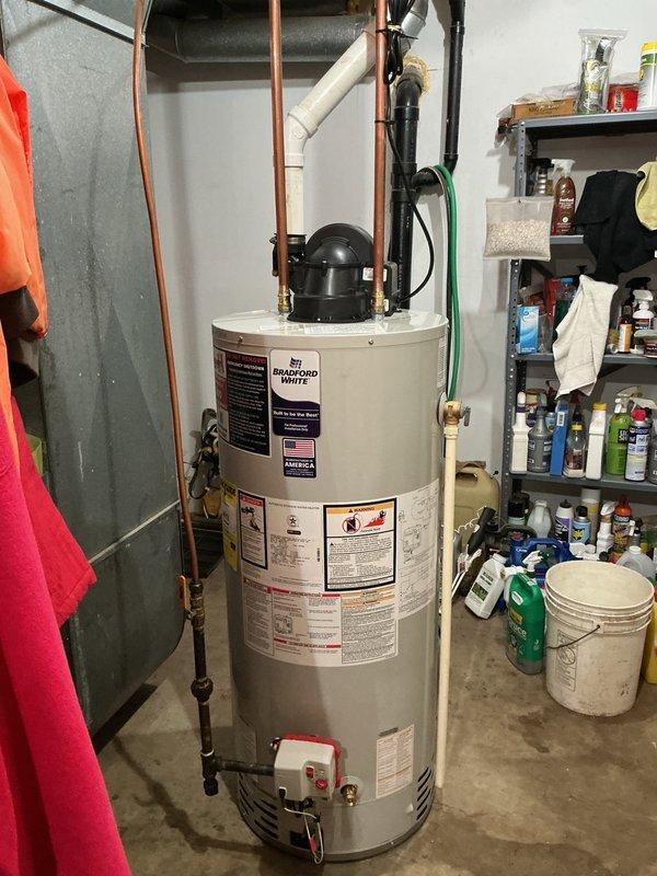 Responded to a leaking propane water heater in the basement. Upon inspection, determined the existing unit had developed a leak and required full replacement. Removed the old water heater and installed a new Bradford White 40-gallon LP power vent water heater. Connected all copper supply lines, installed expansion tank, and ensured proper venting configuration. Performed complete gas line pressure testing to verify system integrity and conducted operational testing to confirm proper ignition, heating function, and safety controls. All connections were secured and system left in full working order.