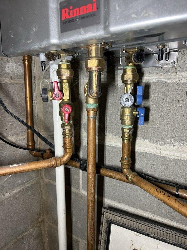 Completed annual heating maintenance visit on residential system including one furnace, two gas fireplaces, one garage heater, and humidifier. Performed comprehensive furnace tune-up with inspection and cleaning of flame sensor and ignition assembly. Inspected blower wheel, air filtration system, and inducer motor with amperage readings within specification. Measured flame sensor microamps and verified gas valve operation. Conducted combustion analysis showing system operating at 93.6% efficiency with safe carbon monoxide levels. Verified gas pressure and performed heat exchanger scope inspection. During internal heat exchanger examination, identified hairline crack that has not progressed past the crimp point. Issued safety advisory form documenting heat exchanger condition. All burners inspected and operating properly. System currently functioning within normal parameters. Documentation and photos provided for service records.