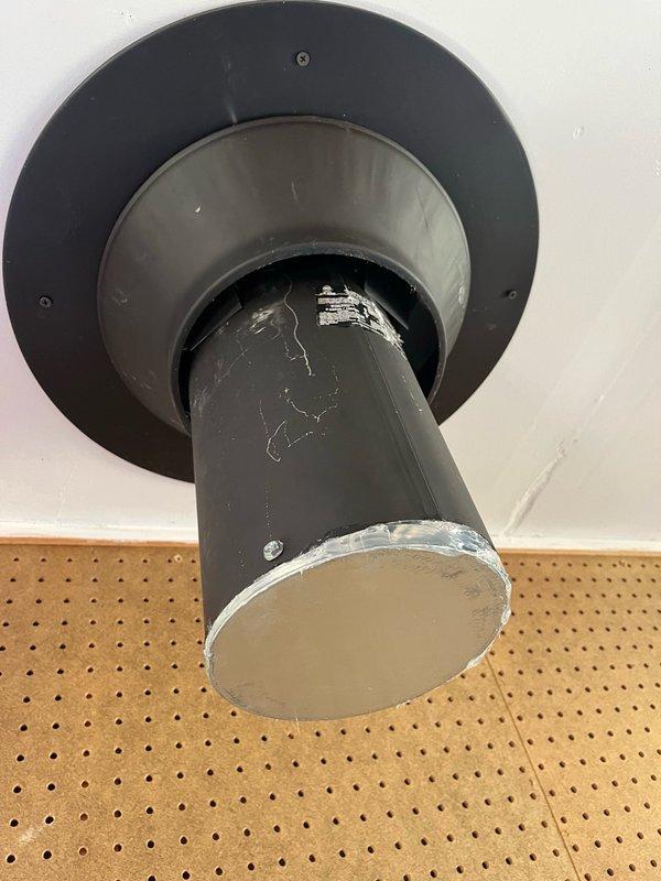 Removed and capped old chimney pipe penetration through ceiling. Installed new 7-inch chimney cap on interior side of chimney opening and properly sealed to prevent air infiltration and weather intrusion. All materials sourced from shop stock.