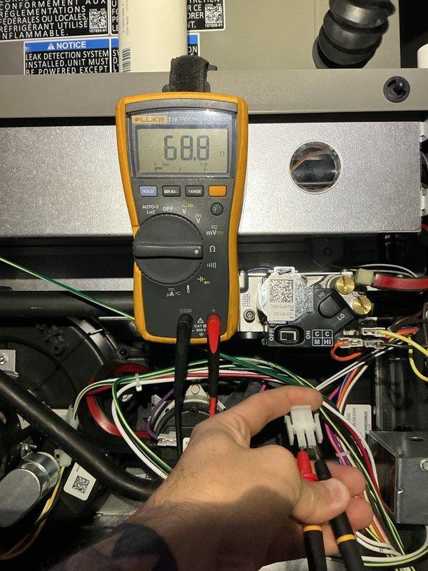 Completed fall preventative maintenance on three Lennox furnace units and two humidifier systems. Performed comprehensive service on all three furnaces including flushing condensate drain lines, cleaning flame sensors, and inspecting blower motors, inducer motors, and gas pressure—all components found operating within normal parameters. Replaced two air filters, including one 16x25x5 filter, and replaced one humidifier filter while inspecting the second which remained in serviceable condition. Verified electrical connections and control systems using multimeter diagnostics. Humidifiers confirmed non-operational due to existing indoor humidity level at 60%, which is above activation threshold. All systems tested and operating properly upon completion of maintenance protocol.