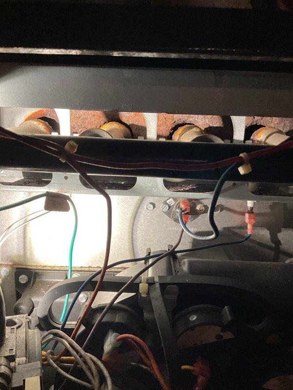 Completed winter tune-up on a 13-15 year old Daikin furnace that was operating properly with no reported issues at time of service. During maintenance inspection, discovered severe burner and heat exchanger deck corrosion caused by excessive moisture exposure from the unconditioned crawlspace combined with the furnace drawing combustion air from the indoor space. Documented the advanced corrosion with photographs showing deteriorated burner assembly components and compromised internal surfaces, and advised homeowner of the safety concerns and need for professional consultation regarding system replacement options.