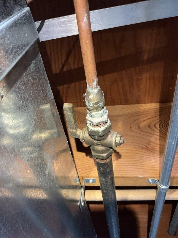 Performed on-site assessment of gas range installation that was rejected by appliance installer due to code compliance issues. Evaluated existing gas line configuration and determined that installation of a shut-off valve and drip-leg (sediment trap) is required to meet current code standards for gas appliance connection. Documented existing copper and black iron pipe configuration with photographs for office review and estimate preparation.