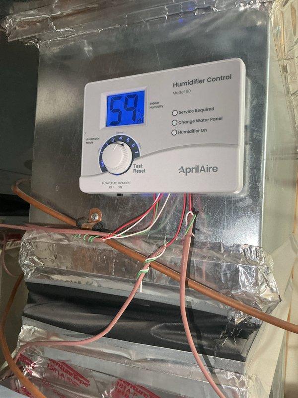 Installed AprilAire 600 humidifier and 16x25 electronic air cleaner to existing HVAC ductwork system. Wired humidifier control (Model 60) for automatic operation with heat-only activation, removing previous humidistat wiring. Completed installation with full system testing to verify proper operation of both humidifier and air cleaner units.