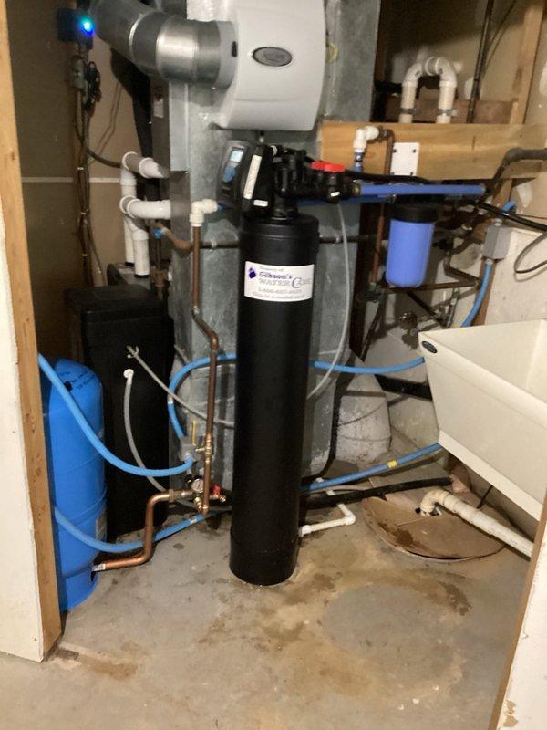 Responded to emergency plumbing leak in basement utility room. Located major pipe burst in area containing water treatment system and water heater. Removed damaged section of failed pipe and installed new PEX piping above water heater unit. Replaced broken pipe section beneath sink basin, securing connections with proper mounting brackets. Tested all repaired sections for leaks and verified system integrity upon completion.
