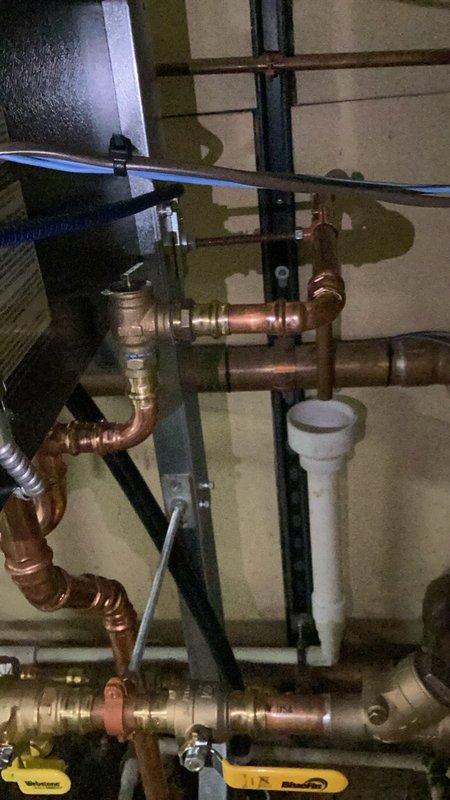 Completed inspection callback on commercial boiler system to address faulty pressure relief valves. Removed existing pressure relief valve and relocated to improved position for proper operation and code compliance. Installed new copper piping with soldered joints and brass fittings to connect relief valve discharge to building drain system via indirect waste connection, ensuring safe discharge of water in the event of overpressure conditions. All work completed per applicable plumbing and mechanical codes.
